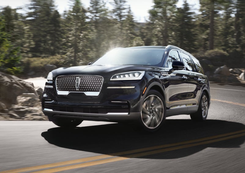 A Lincoln Aviator® SUV is being driven on a winding mountain road | Bondy's Lincoln in Dothan AL