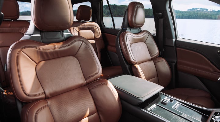 The front row's Perfect Position Seats in a 2024 Lincoln Aviator® Reserve model with Ebony Roast interior | Bondy's Lincoln in Dothan AL