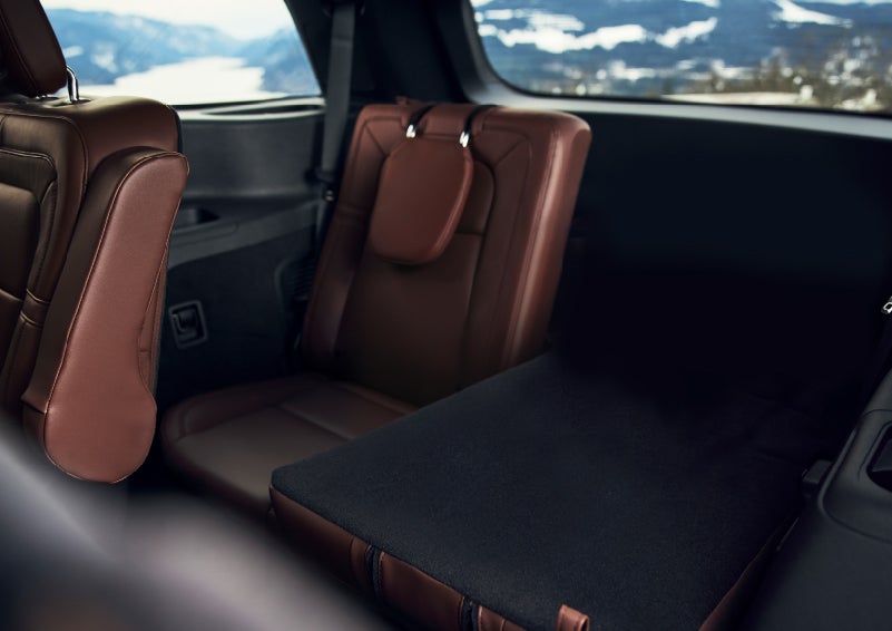 The left rear seat of a 2024 Lincoln Aviator® SUV is shown folded flat for additional cargo space | Bondy's Lincoln in Dothan AL