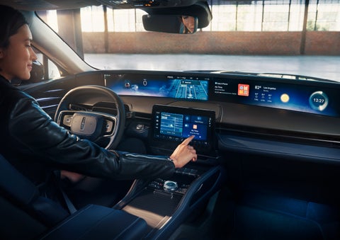 The driver of a 2024 Lincoln Nautilus® SUV interacts with the center touchscreen. | Bondy's Lincoln in Dothan AL