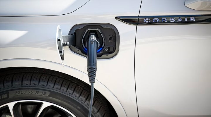 An electric charger is shown plugged into the charging port of a Lincoln Corsair® Grand Touring
model. | Bondy's Lincoln in Dothan AL