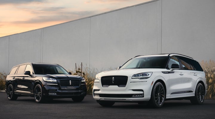 Two Lincoln Aviator® SUVs are shown with the available Jet Appearance Package | Bondy's Lincoln in Dothan AL