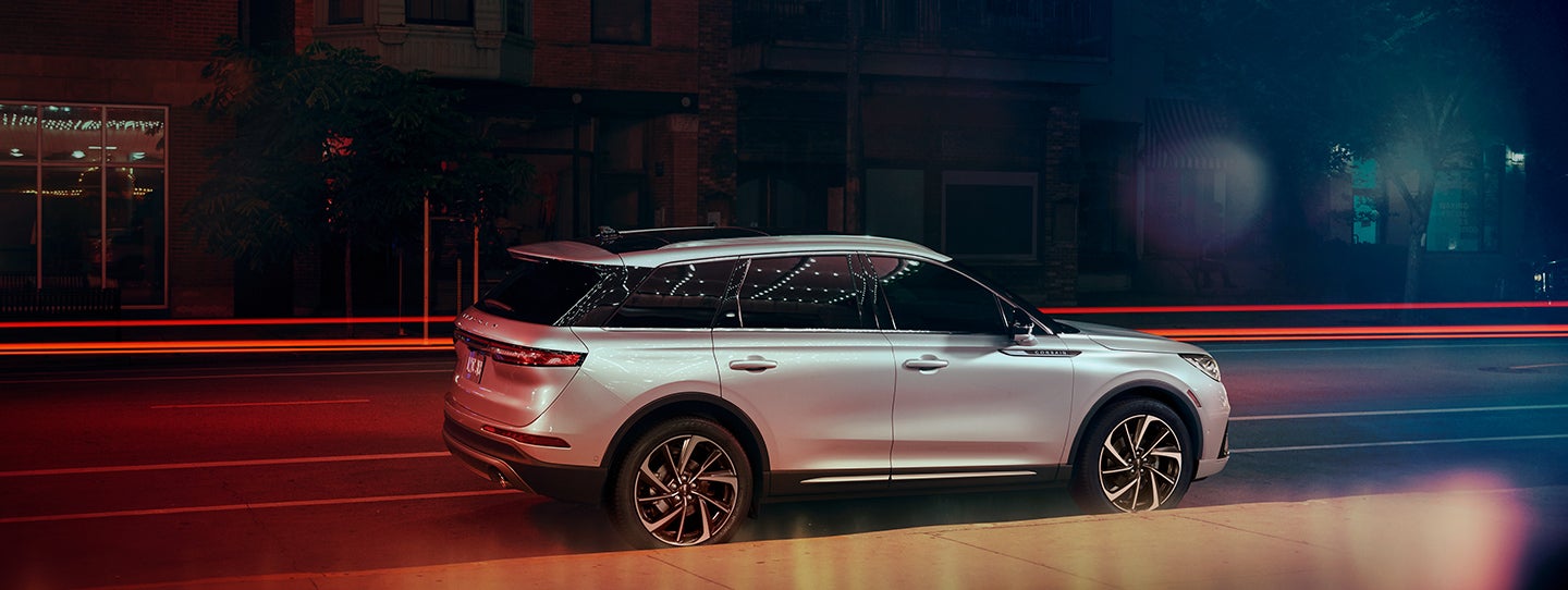 The 2024 Lincoln Corsair® SUV is parked on a city street at night. | Bondy's Lincoln in Dothan AL
