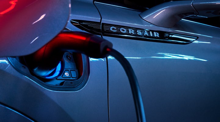 A charger plugged into the charging port of a 2024 Lincoln Corsair® Plug-in Hybrid model. | Bondy's Lincoln in Dothan AL