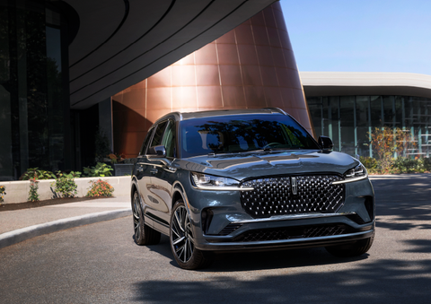 A gray 2025 Lincoln Aviator® SUV is parked outside a modern building with the sun shining. | Bondy's Lincoln in Dothan AL