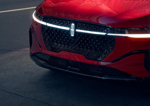 The available front LED light bar and center Lincoln Star logo glow at dusk. | Bondy's Lincoln in Dothan AL