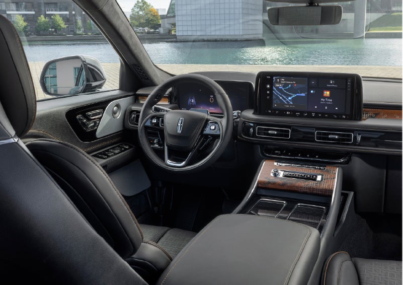 The interior of the 2026 Lincoln Aviator® SUV is shown parked with a view of a harbor through the windshield. | Bondy's Lincoln in Dothan AL