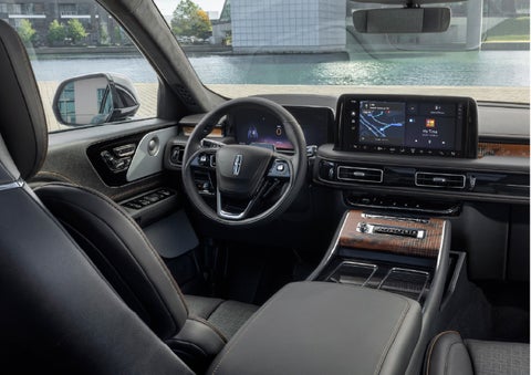 The interior of the 2026 Lincoln Aviator® SUV is shown parked with a view of a harbor through the windshield. | Bondy's Lincoln in Dothan AL