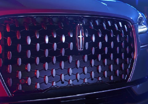 The grille of a 2025 Lincoln Corsair&reg; SUV reflects neon light at night. | Bondy's Lincoln in Dothan AL