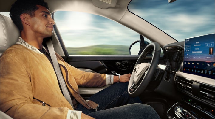 A person is shown using Lincoln BlueCruise hands-free highway driving technology on a divided highway in a hands-free Blue Zone. | Bondy's Lincoln in Dothan AL