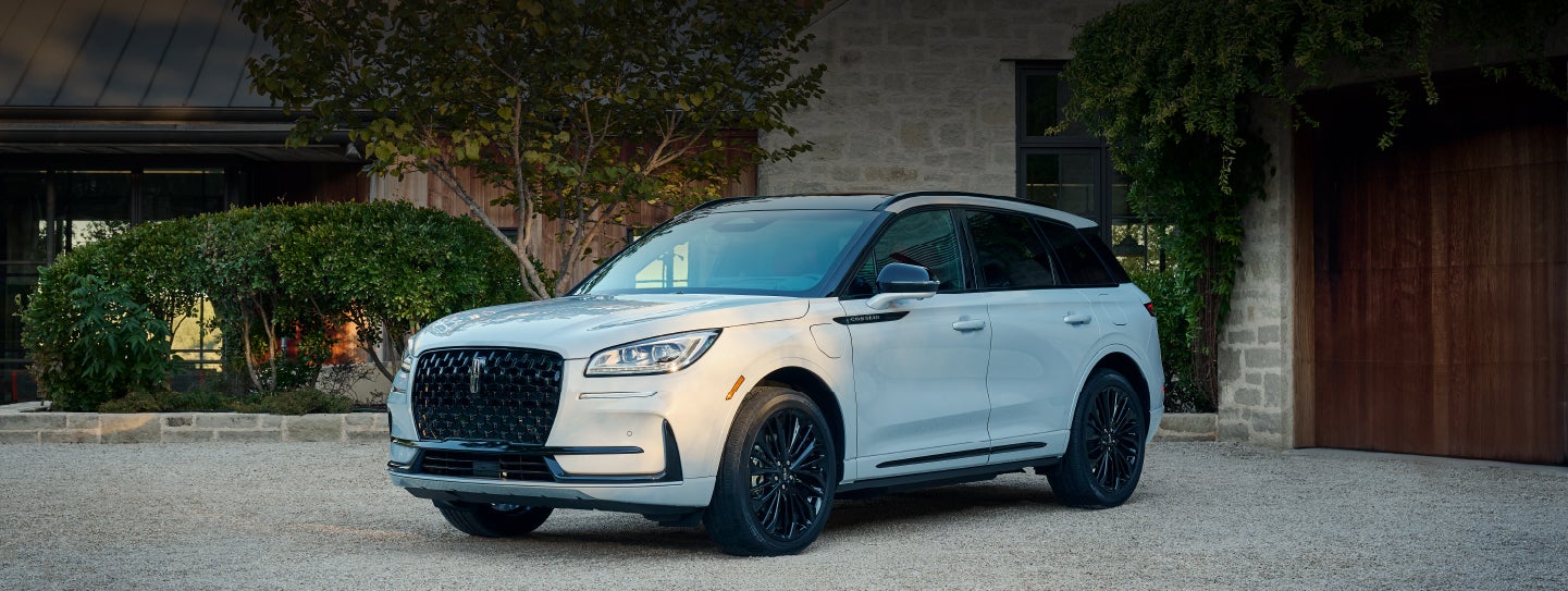 A 2026 Lincoln Corsair® SUV is parked in front off a luxury home. | Bondy's Lincoln in Dothan AL
