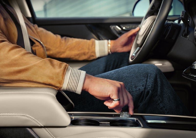 The driver of a 2026 Lincoln Corsair® SUV is shown selecting a drive mode. | Bondy's Lincoln in Dothan AL