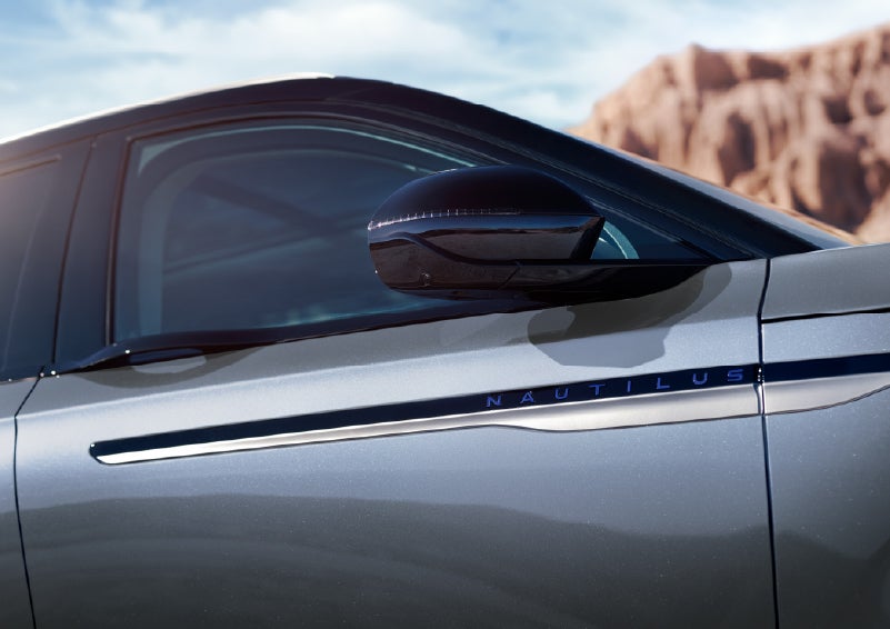 Blue lettering on the side of the vehicle that reads Nautilus indicates the available Hybrid Powertrain. | Bondy's Lincoln in Dothan AL
