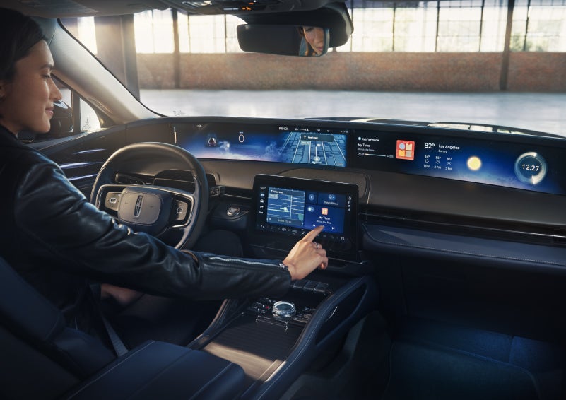 The driver of a 2026 Lincoln Nautilus® SUV interacts with the center touchscreen. | Bondy's Lincoln in Dothan AL
