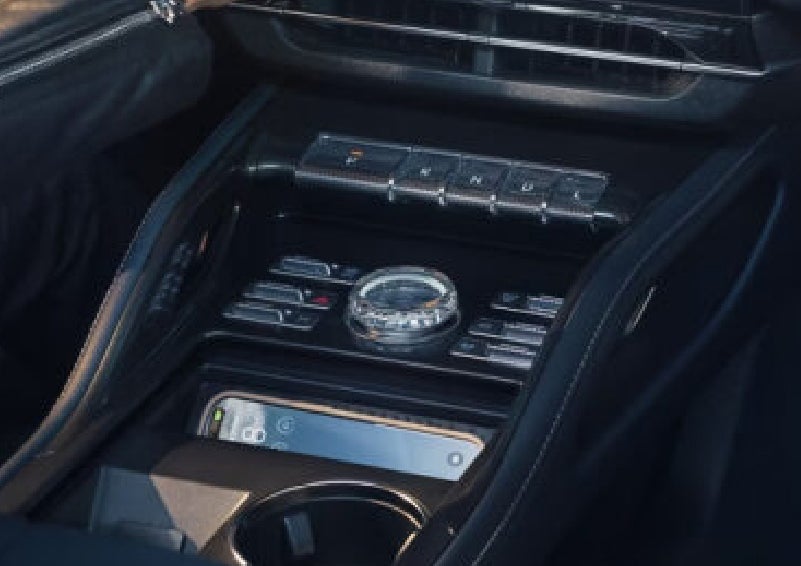 A smartphone is shown charging in the wireless charging pad. | Bondy's Lincoln in Dothan AL