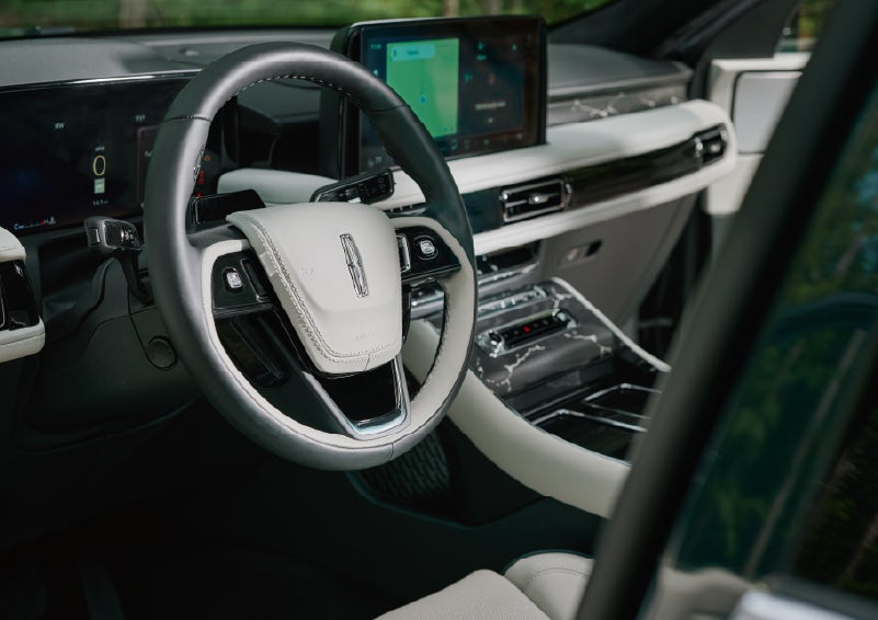 The leather-trimmed steering wheel of a 2027 Lincoln Aviator® Black Label™ SUV. | Bondy's Lincoln in Dothan AL