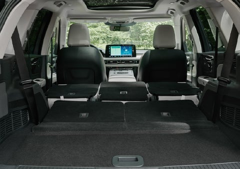 A rear to front view of the interior of a 2027 Lincoln Aviator® Black Label™ SUV shows the third and second rows folded flat | Bondy's Lincoln in Dothan AL
